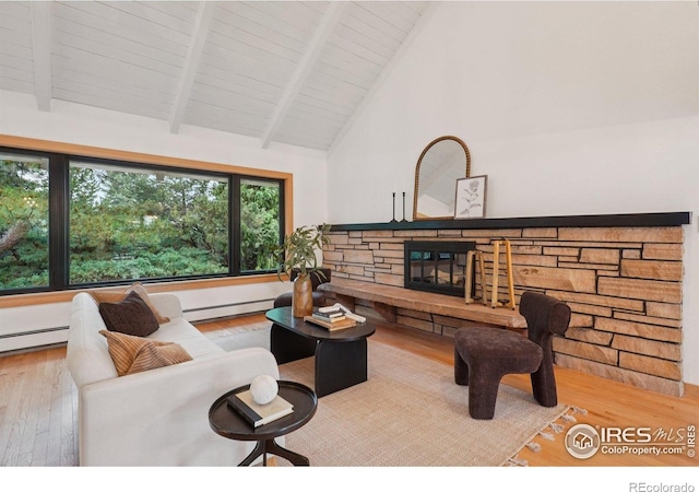 3260 Lafayette Dr, Boulder, CO 80305 - living area with wood finished floors, a baseboard radiator, high vaulted ceiling, a stone fireplace, and wood ceiling with exposed beams
