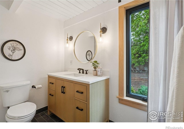 3260 Lafayette Dr, Boulder, CO 80305 - bathroom with vanity, toilet, and tile patterned floors