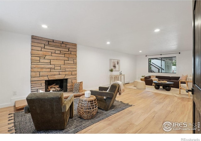 3260 Lafayette Dr, Boulder, CO 80305 - living area featuring wood finished floors, a fireplace, recessed lighting, and baseboards