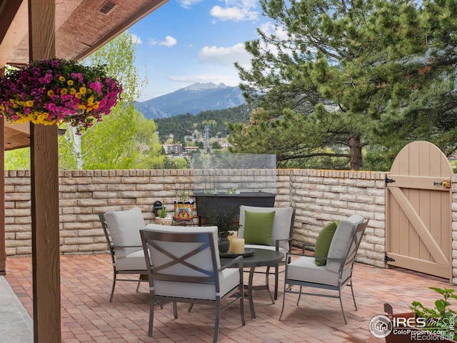 838 Vista Ln, Estes Park, CO 80517 - view of patio / terrace featuring a mountain view and a gate