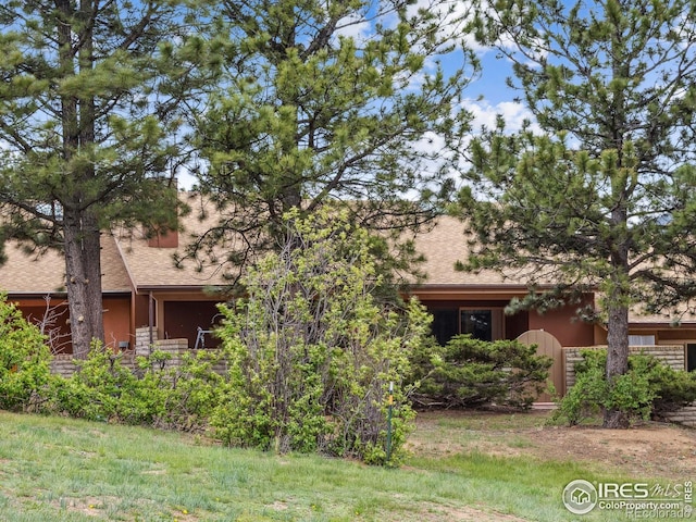 838 Vista Ln, Estes Park, CO 80517 - view of front of home with a shingled roof and stucco siding