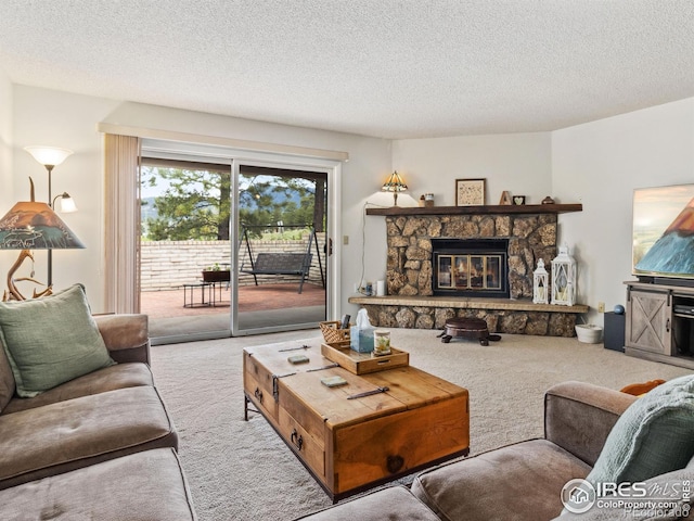 838 Vista Ln, Estes Park, CO 80517 - carpeted living area with a textured ceiling and a stone fireplace