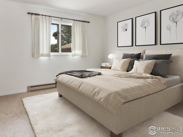 838 Vista Ln, Estes Park, CO 80517 - bedroom with a baseboard heating unit, carpet, and baseboards