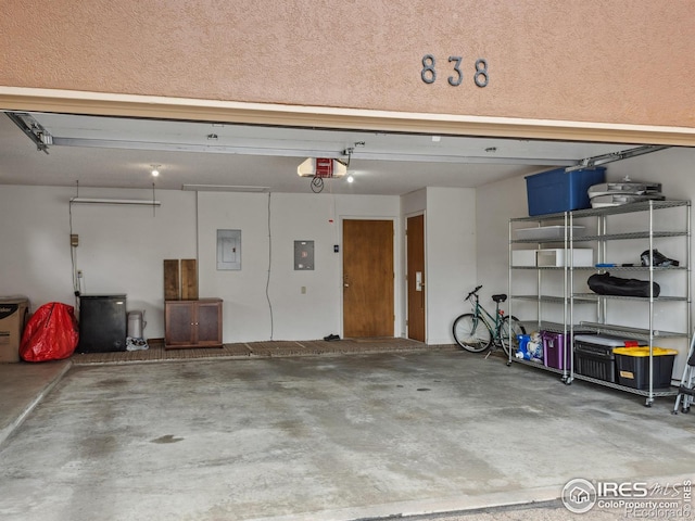 838 Vista Ln, Estes Park, CO 80517 - garage featuring electric panel and a garage door opener