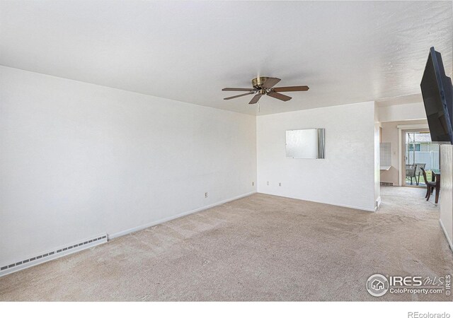 213 S 4th St, La Salle, CO 80645 - empty room with a baseboard heating unit, a ceiling fan, carpet, and baseboards