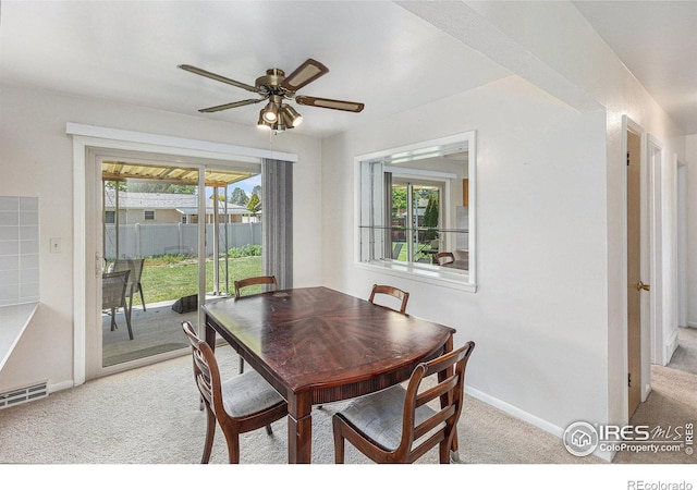 213 S 4th St, La Salle, CO 80645 - dining area with light colored carpet, ceiling fan, and baseboards