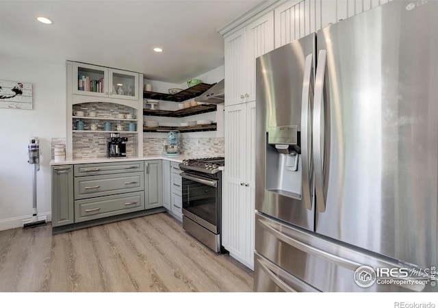 112 Dawson Pl, Longmont, CO 80504 - kitchen featuring stainless steel appliances, open shelves, gray cabinetry, decorative backsplash, and light wood-type flooring