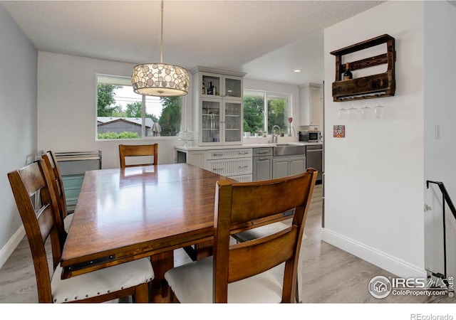 112 Dawson Pl, Longmont, CO 80504 - dining space with light wood finished floors, baseboards, plenty of natural light, and recessed lighting