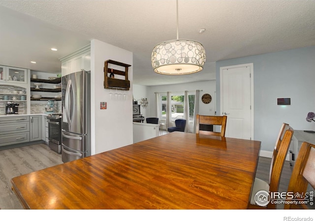 112 Dawson Pl, Longmont, CO 80504 - dining space featuring light wood-style flooring, recessed lighting, and a textured ceiling