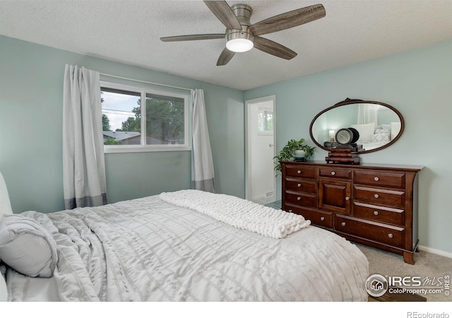 112 Dawson Pl, Longmont, CO 80504 - bedroom featuring a textured ceiling, carpet, baseboards, and a ceiling fan