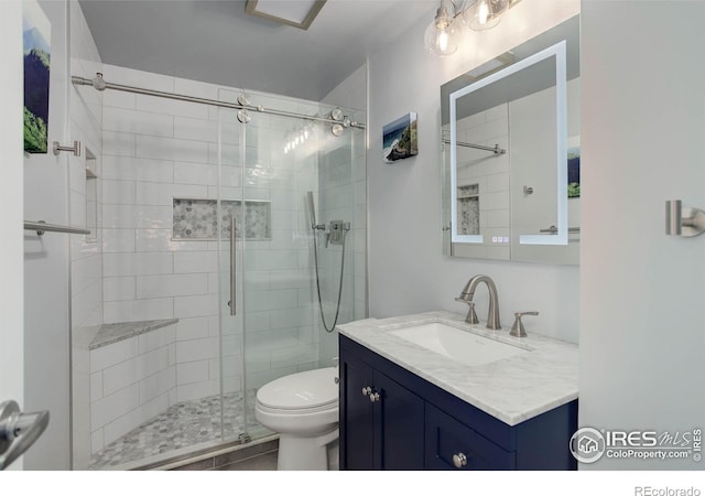 112 Dawson Pl, Longmont, CO 80504 - full bath featuring a shower stall, toilet, and vanity