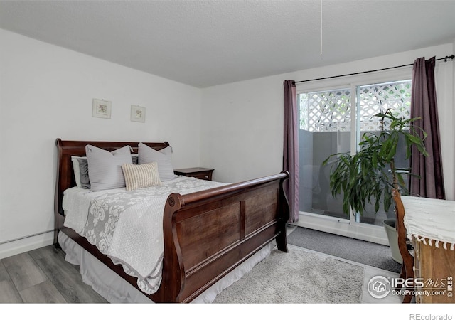 112 Dawson Pl, Longmont, CO 80504 - bedroom featuring wood finished floors and baseboards