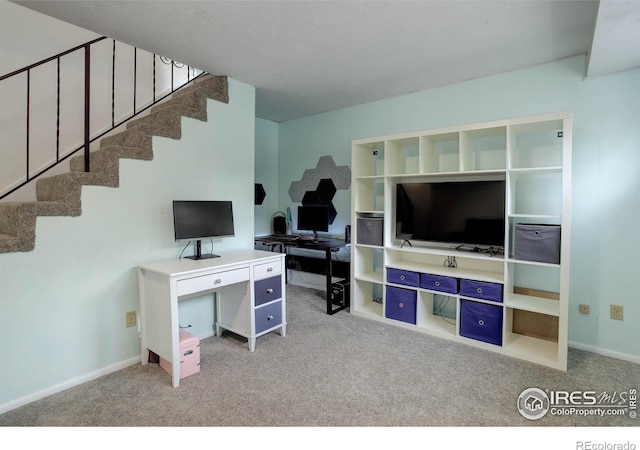112 Dawson Pl, Longmont, CO 80504 - carpeted living area featuring stairway, a desk, and baseboards