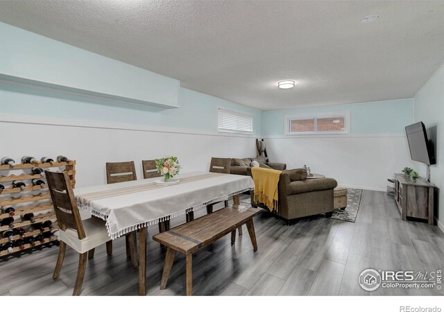 112 Dawson Pl, Longmont, CO 80504 - dining space with light wood finished floors and a textured ceiling