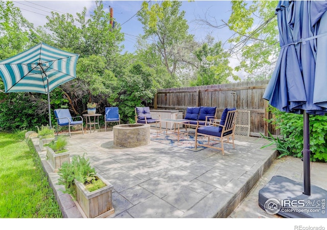 112 Dawson Pl, Longmont, CO 80504 - fenced backyard with an outdoor living space with a fire pit and a patio