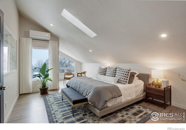 1048 Westview Dr, Boulder, CO 80303 - bedroom featuring a wall unit AC, vaulted ceiling, wood finished floors, a skylight, and baseboards