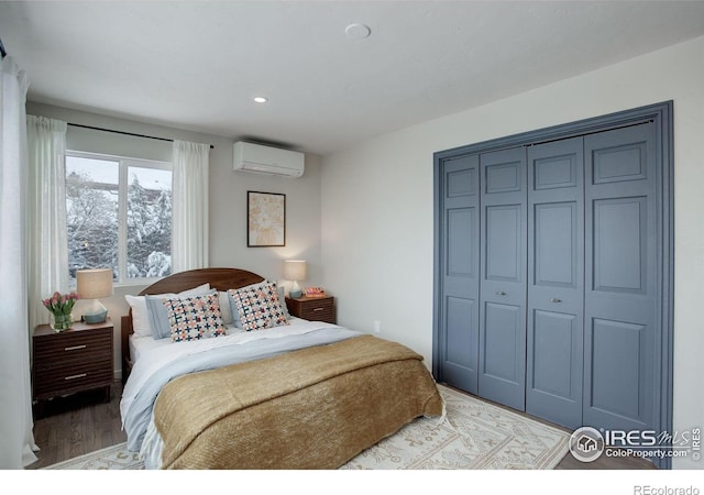 1048 Westview Dr, Boulder, CO 80303 - bedroom featuring a wall mounted AC, a closet, light wood-style flooring, and recessed lighting