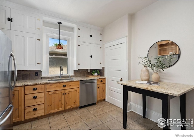 729 Peterson St, Fort Collins, CO 80524 - kitchen with appliances with stainless steel finishes, a sink, decorative backsplash, and pendant lighting
