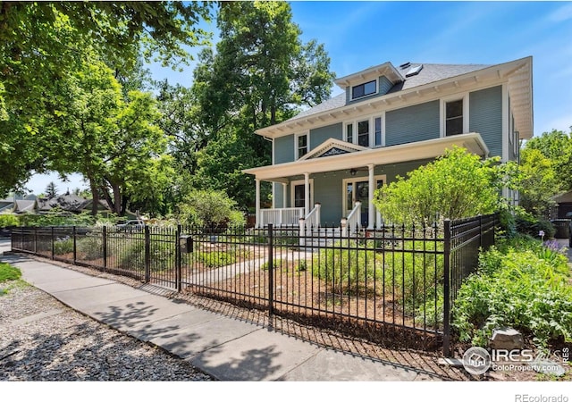 729 Peterson St, Fort Collins, CO 80524 - american foursquare style home featuring a porch and a fenced front yard