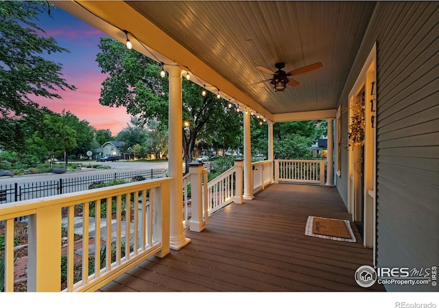729 Peterson St, Fort Collins, CO 80524 - deck at dusk with a porch and ceiling fan