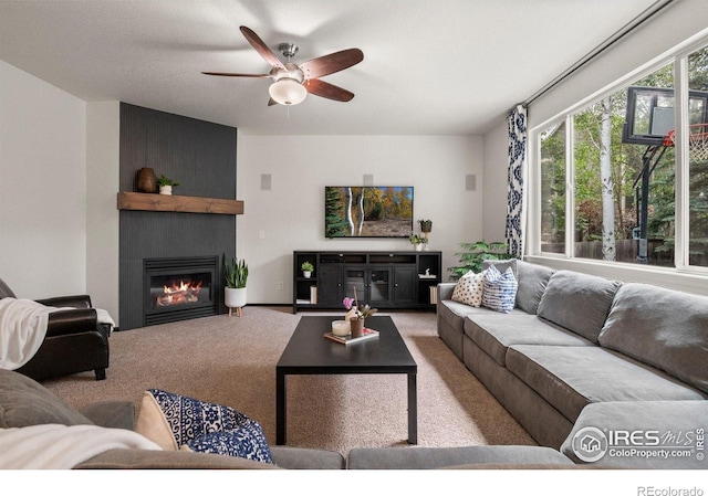 1682 Crestview Ln, Erie, CO 80516 - living room featuring a large fireplace, carpet, and ceiling fan
