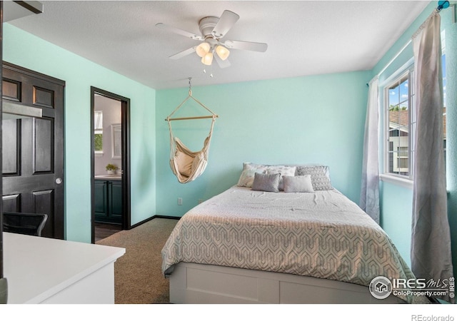 1682 Crestview Ln, Erie, CO 80516 - bedroom with carpet floors, baseboards, ensuite bathroom, and ceiling fan
