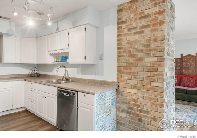 1901 W 101st Ave, Thornton, CO 80260 - kitchen featuring stainless steel dishwasher, a sink, white cabinetry, and wood finished floors