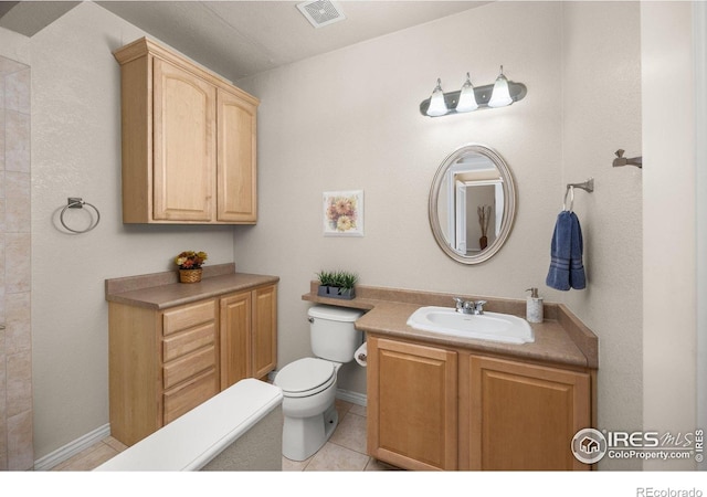 14246 Piney River Rd, Broomfield, CO 80023 - bathroom with toilet, vanity, and tile patterned flooring