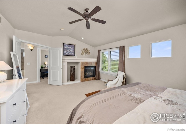 14246 Piney River Rd, Broomfield, CO 80023 - bedroom featuring light carpet, a premium fireplace, lofted ceiling, and ceiling fan