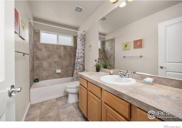 14246 Piney River Rd, Broomfield, CO 80023 - full bath with vanity, toilet, shower / tub combo, and baseboards