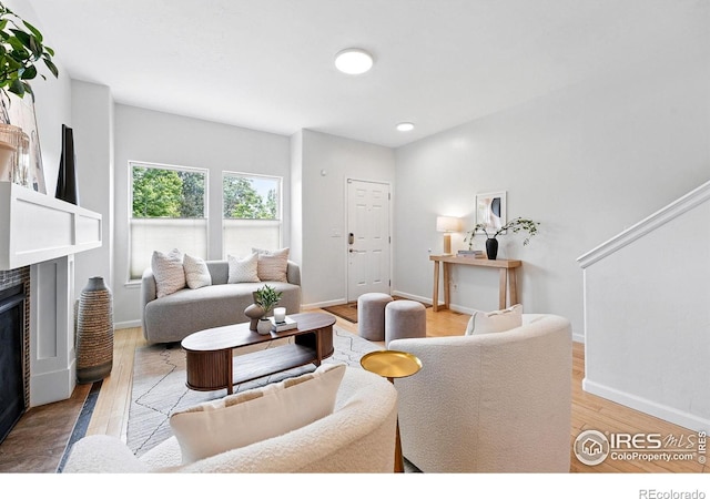 4039 N Clay St, Denver, CO 80211 - living room featuring a fireplace, light wood-style floors, baseboards, and recessed lighting
