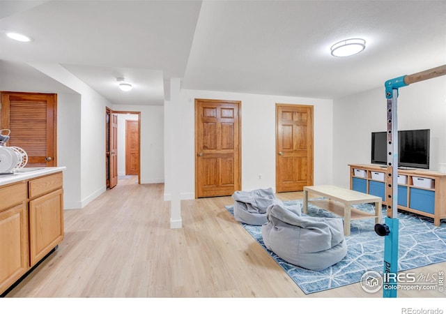 1067 W Alder St, Louisville, CO 80027 - living room featuring light wood-type flooring and baseboards