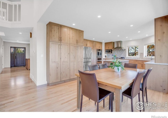1067 W Alder St, Louisville, CO 80027 - dining room featuring plenty of natural light, light wood-style flooring, and recessed lighting
