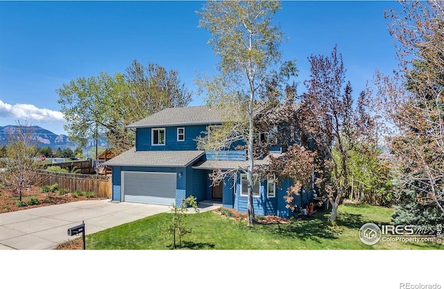 1067 W Alder St, Louisville, CO 80027 - view of front of house with concrete driveway, a garage, and a shingled roof