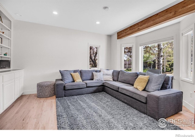 1067 W Alder St, Louisville, CO 80027 - living room featuring light wood finished floors, recessed lighting, and beam ceiling