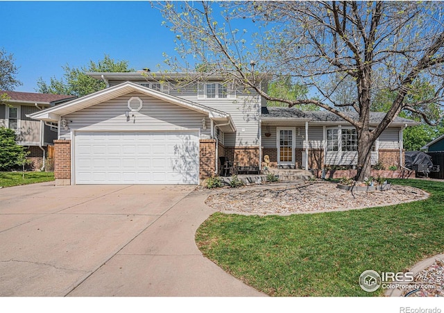 514 Palisade Mountain Dr, Windsor, CO 80550 - view of front of house with brick siding, concrete driveway, and an attached garage