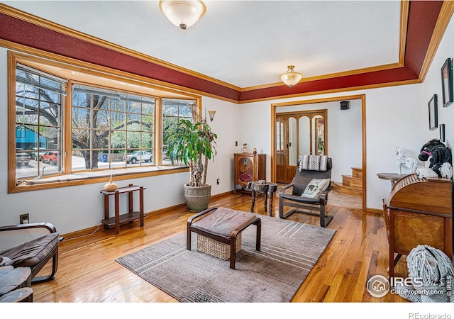514 Palisade Mountain Dr, Windsor, CO 80550 - living room with ornamental molding, wood finished floors, and baseboards