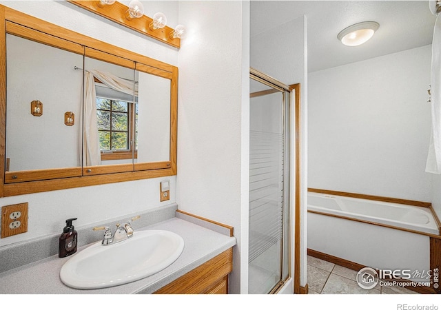 514 Palisade Mountain Dr, Windsor, CO 80550 - full bath with a stall shower, vanity, a garden tub, and tile patterned flooring