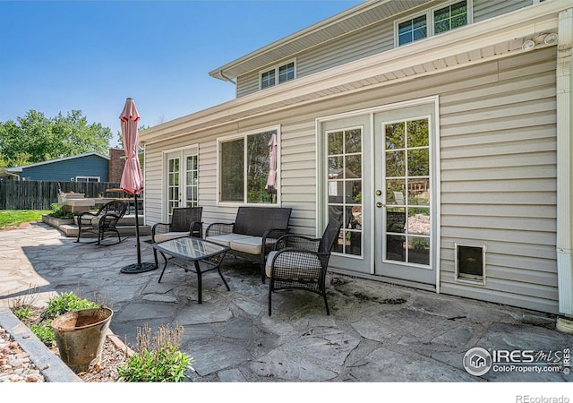 514 Palisade Mountain Dr, Windsor, CO 80550 - view of patio / terrace with french doors and an outdoor hangout area