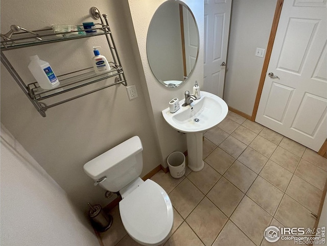 2314 42nd Avenue Ct, Greeley, CO 80634 - bathroom with toilet and tile patterned flooring