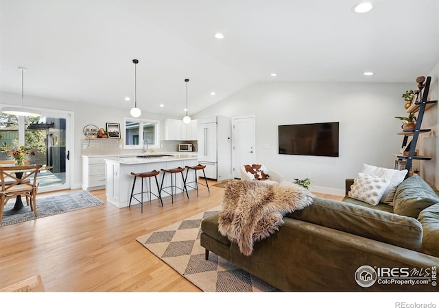 1670 Linden Ave, Boulder, CO 80304 - living area featuring recessed lighting, vaulted ceiling, and light wood finished floors