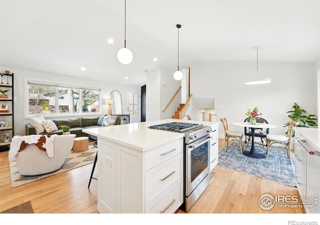 1670 Linden Ave, Boulder, CO 80304 - kitchen featuring high end stove, light wood-type flooring, white cabinets, vaulted ceiling, and recessed lighting