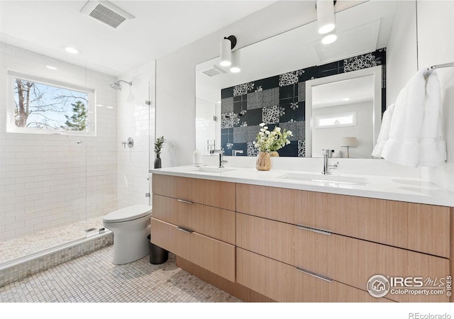 1670 Linden Ave, Boulder, CO 80304 - full bath featuring tiled shower, double vanity, toilet, and tile patterned flooring