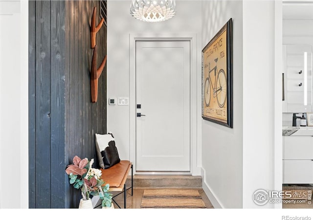 1670 Linden Ave, Boulder, CO 80304 - entryway featuring baseboards and a chandelier