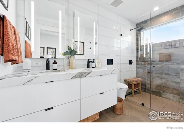 1670 Linden Ave, Boulder, CO 80304 - full bathroom featuring a shower stall, vanity, toilet, and tile walls
