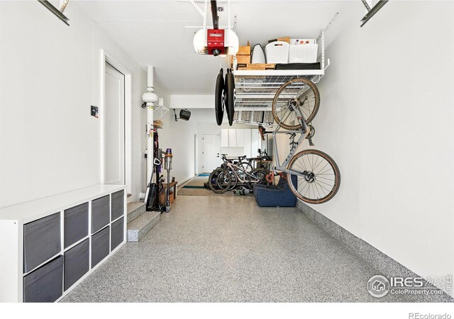1670 Linden Ave, Boulder, CO 80304 - garage featuring a garage door opener and baseboards