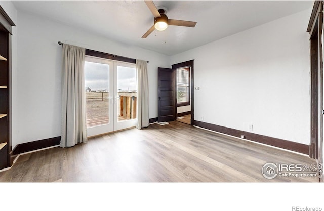 9571 Gray Ave, Carr, CO 80612 - spare room with french doors, light wood finished floors, a ceiling fan, and baseboards