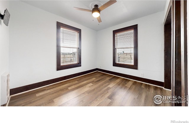 9571 Gray Ave, Carr, CO 80612 - empty room with baseboards, wood finished floors, and a ceiling fan