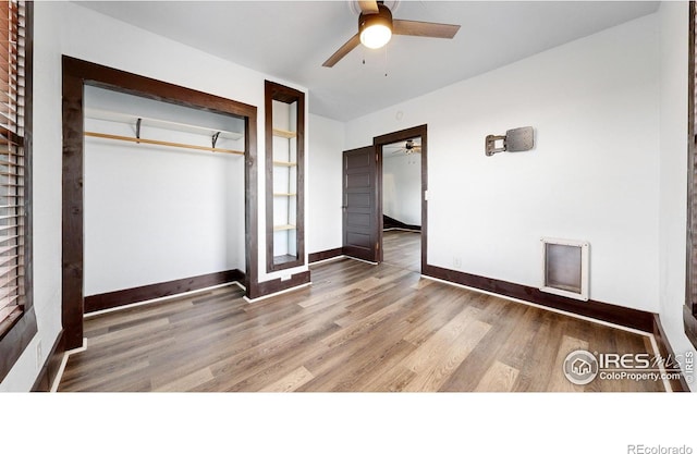 9571 Gray Ave, Carr, CO 80612 - unfurnished bedroom with wood finished floors, baseboards, a closet, and ceiling fan