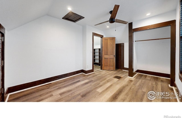 9571 Gray Ave, Carr, CO 80612 - unfurnished bedroom featuring vaulted ceiling, wood finished floors, baseboards, a closet, and recessed lighting